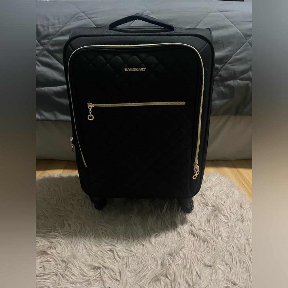 Black and gold carry on suitcase